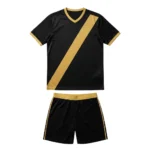 Front view of the Shadow Phantom custom soccer kit in jet black and warm gold, featuring a sublimated hexagonal geometric pattern, a diagonal gold sash, and V-neck collar for professional sports teams