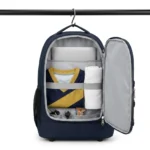 Kitora Icon Backpack clamshell opening hanging from its integrated steel locker hook with kit visible inside
