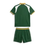 Back view flat lay of the Pared Elite green custom padel polo shirt with white shoulder panels and gold waistband shorts