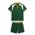 Flat lay front view of the Pared Elite green padel polo shirt featuring gold collar trim, white accents, and matching shorts