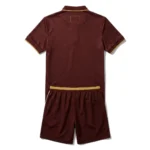 Back view flat lay of the Raqueta Real custom burgundy padel polo shirt with patterned fabric and gold elastic waistband shorts