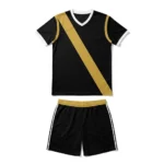 Flat lay front view of the Smash Elite black custom volleyball jersey featuring a diagonal gold sash stripe, white trim, and matching shorts