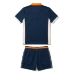 Back view flat lay of the Vidrio Pro navy custom padel polo shirt with white side panels and orange waistband shorts